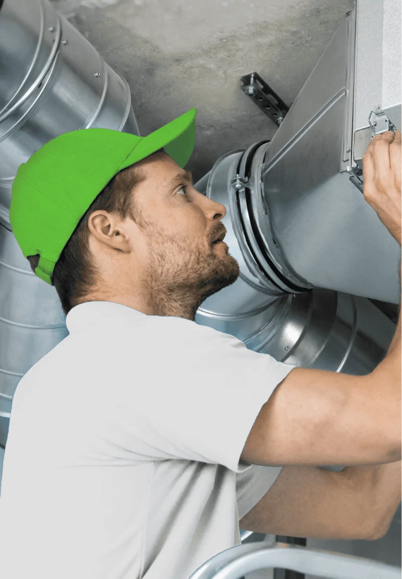 technician in a green hat